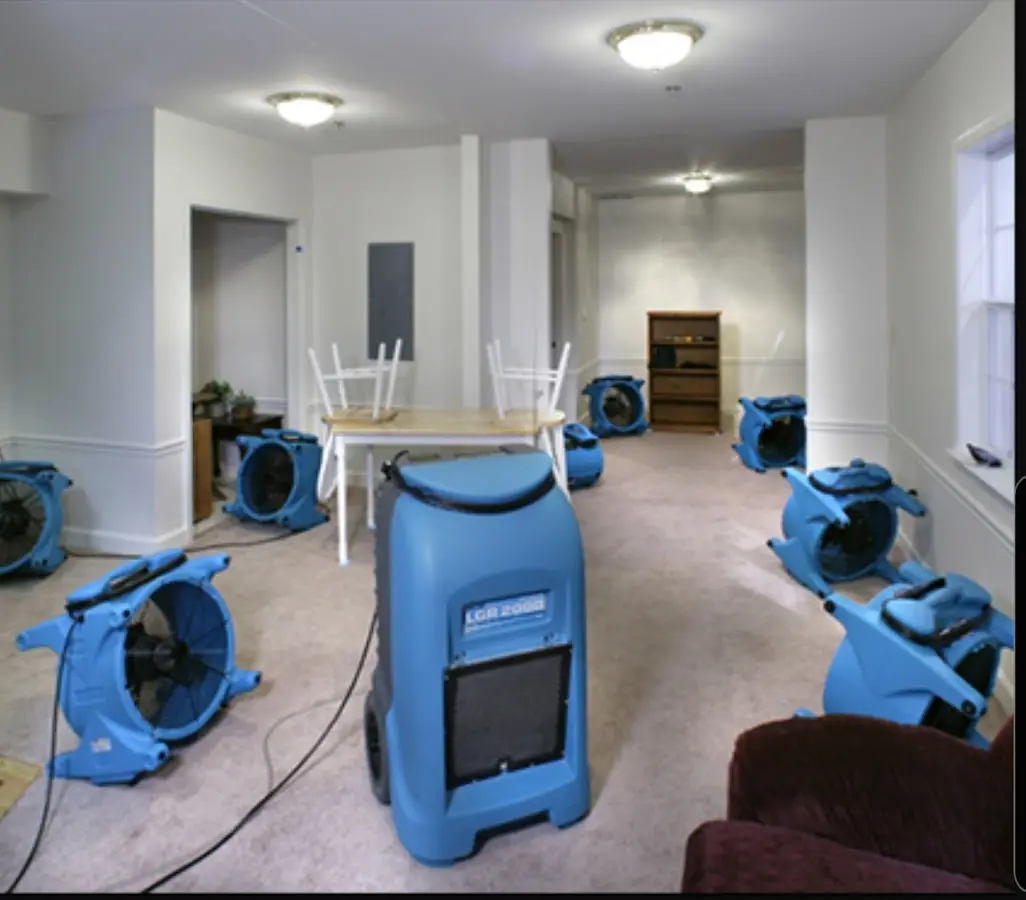 Air movers and dehumidifier setup for Water Damage Restoration in University